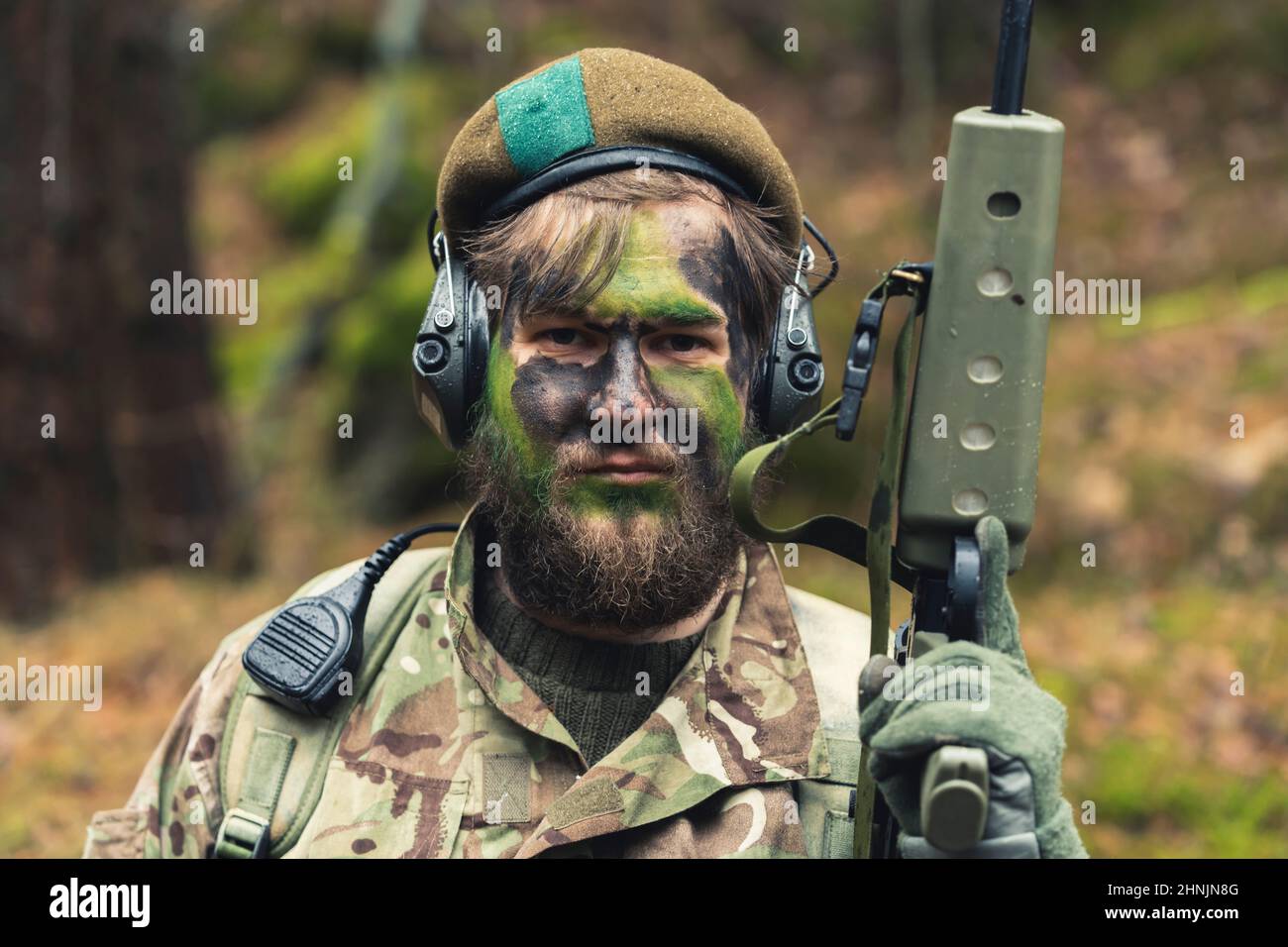 Adamant unshaven hot blooded soldier proudly posing . High quality photo Stock Photo
