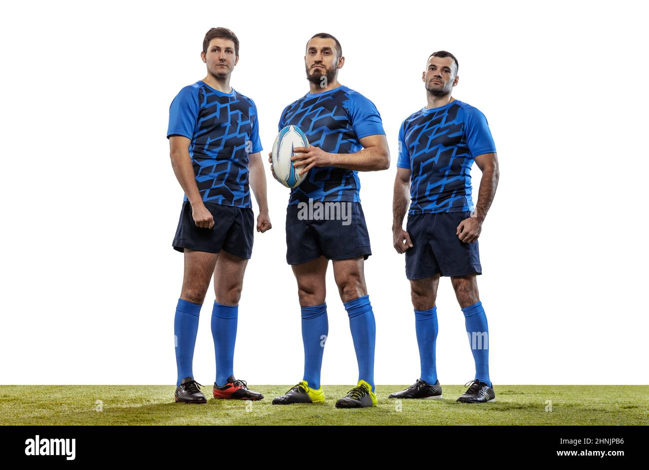 Group portrait of strong athletes, rugby players standing together like