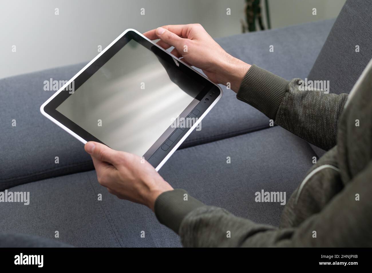 hands of a man holding blank tablet device Stock Photo - Alamy