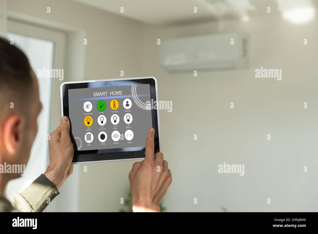 manipulating air conditioner with tablet Stock Photo Alamy