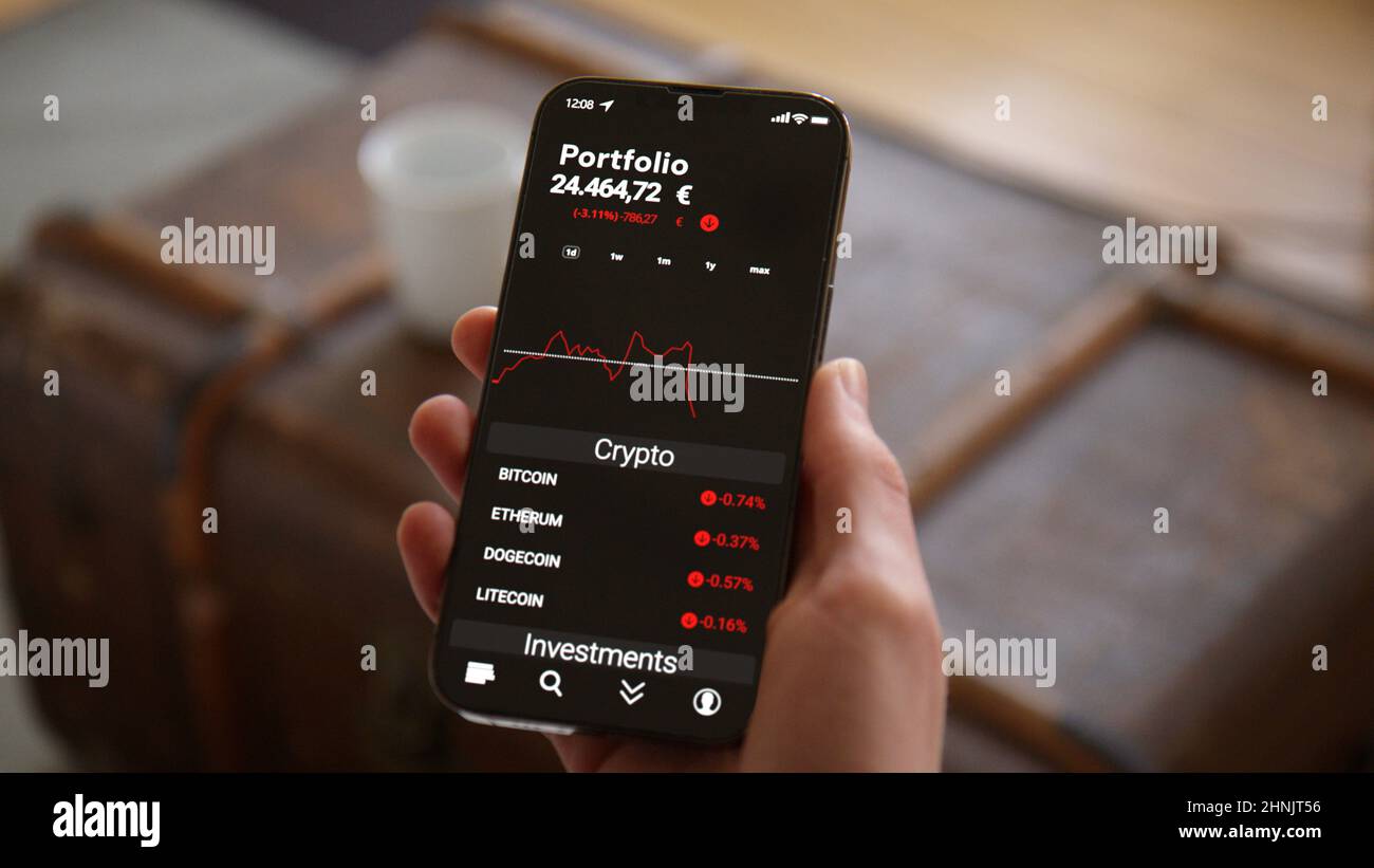Hand holding Phone with Trading App Mockup watching Crypto Currency  Investment falling in Euros Stock Photo - Alamy