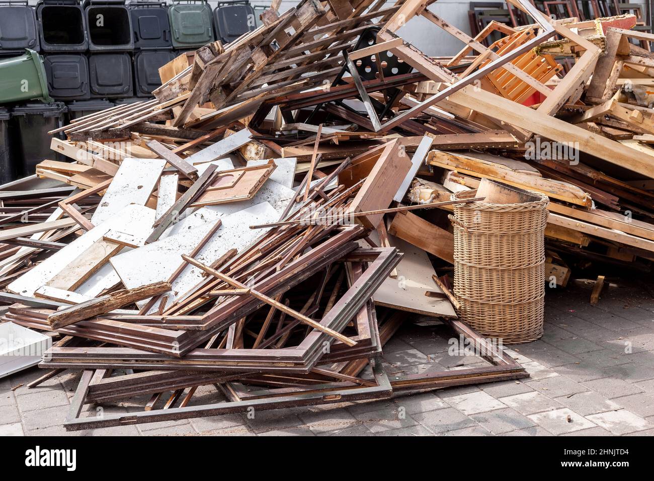 Recycling dump with trash of broken window and door frames, furniture