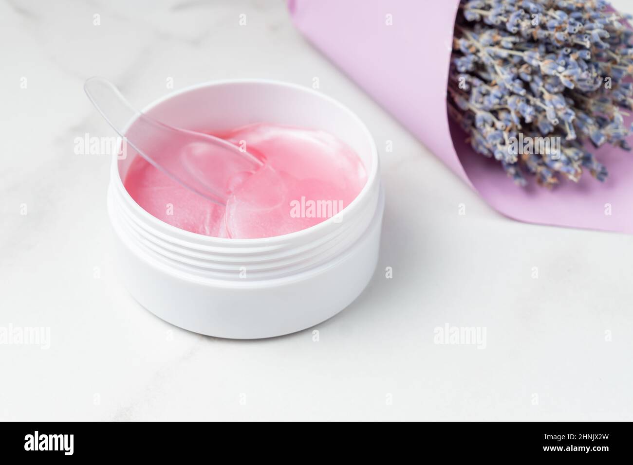 Pink eye patches to reduce puffiness and bruising under the eyes with