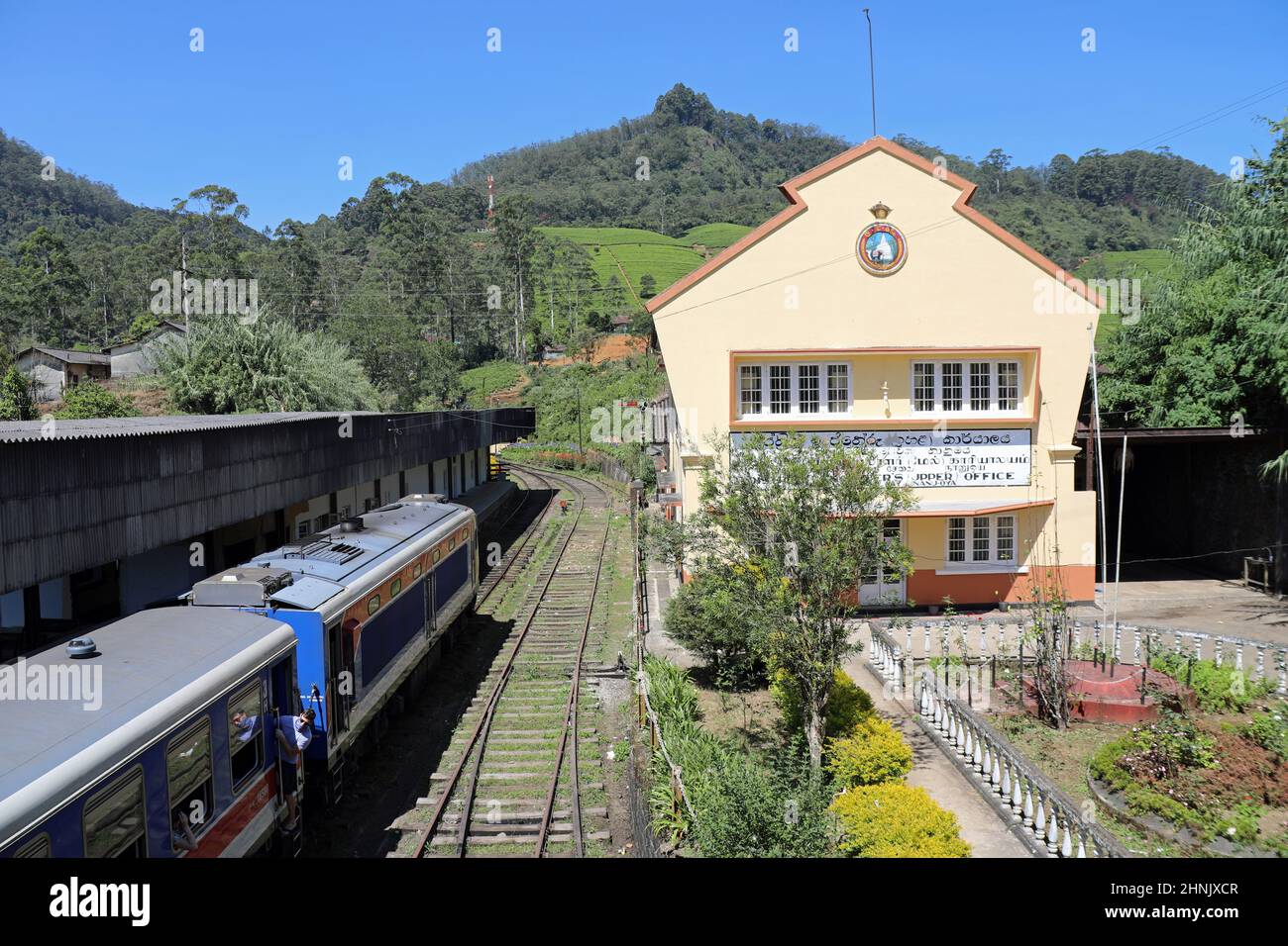 The train from Kandy to Nuwara Eliya passing Nanu Oya Railway Station in Sri Lanka Stock Photo