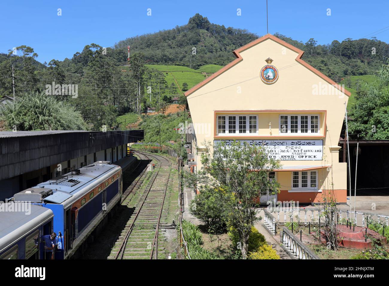 The train from Kandy to Nuwara Eliya passing Nanu Oya Railway Station in Sri Lanka Stock Photo