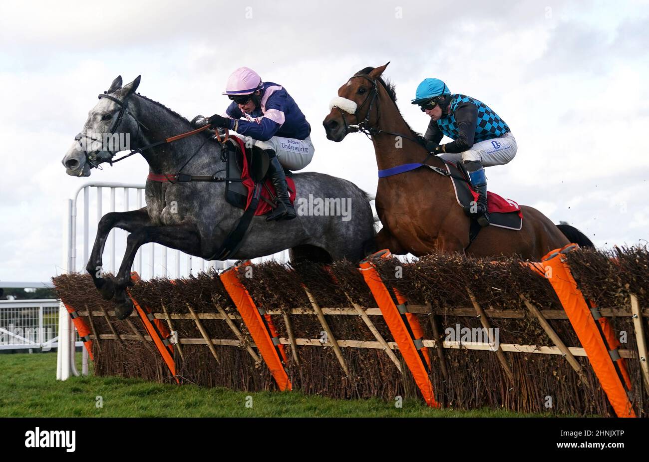 Monviel and Tom O'Brien (left) leads from Operation Manna and Stan Sheppard on their way to winning the Virgin Bet 'National Hunt' Novices' Hurdle at Sandown Park Racecourse. Picture date: Thursday February 17, 2022. Stock Photo