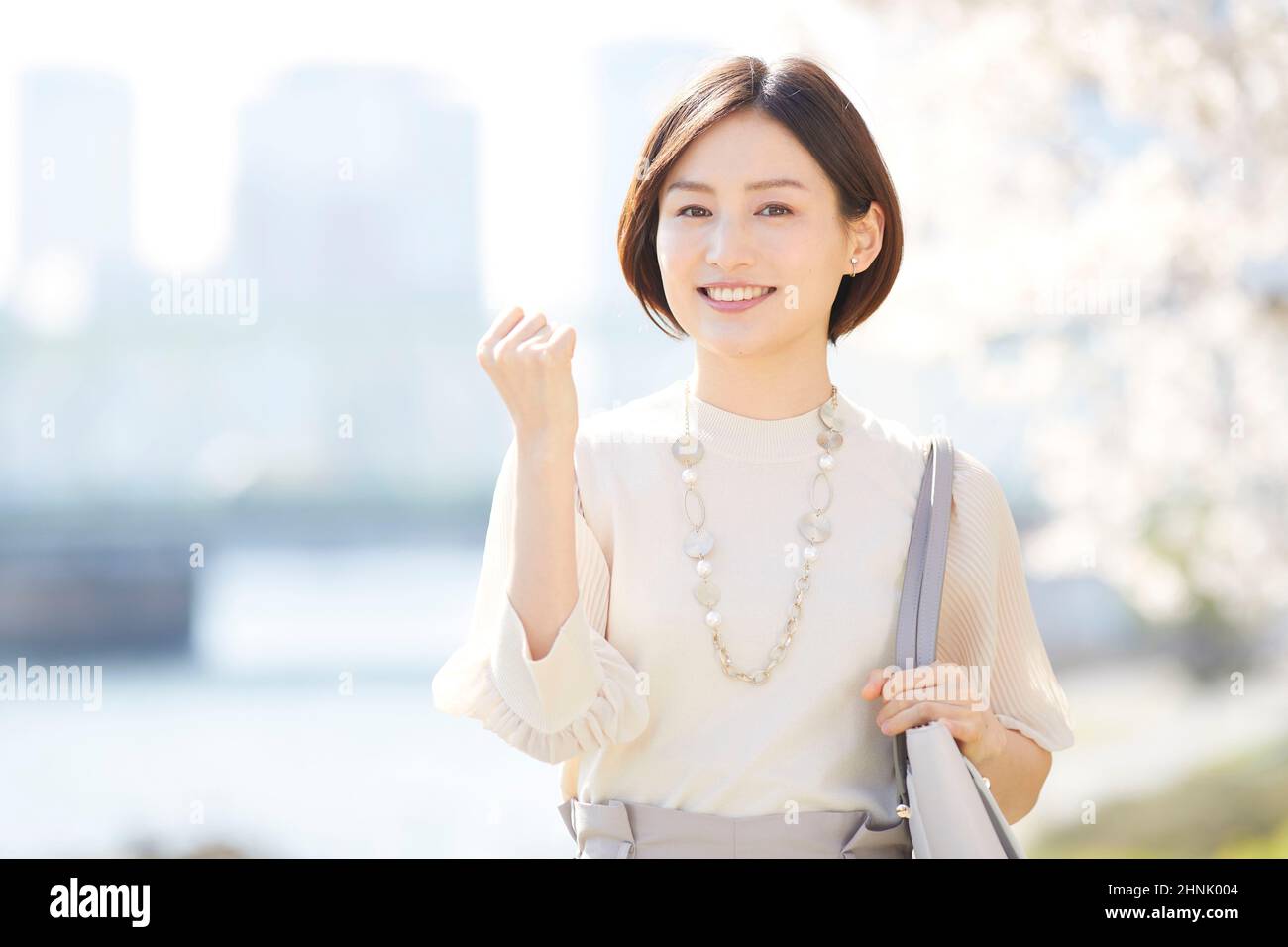 Young Japanese Woman Making Hand Sign Stock Photo - Alamy