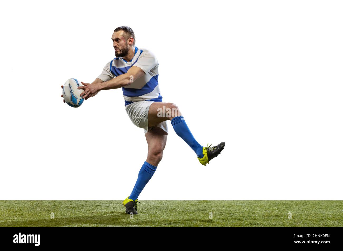 Fast forward. Male rugby player catching ball in jump isolated on white