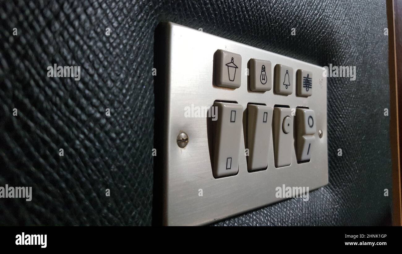 Seventies style switch panel for hotel. Closeup Stock Photo