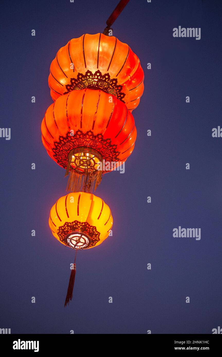 Traditional chinese restaurant paper lantern. Dusk background Stock