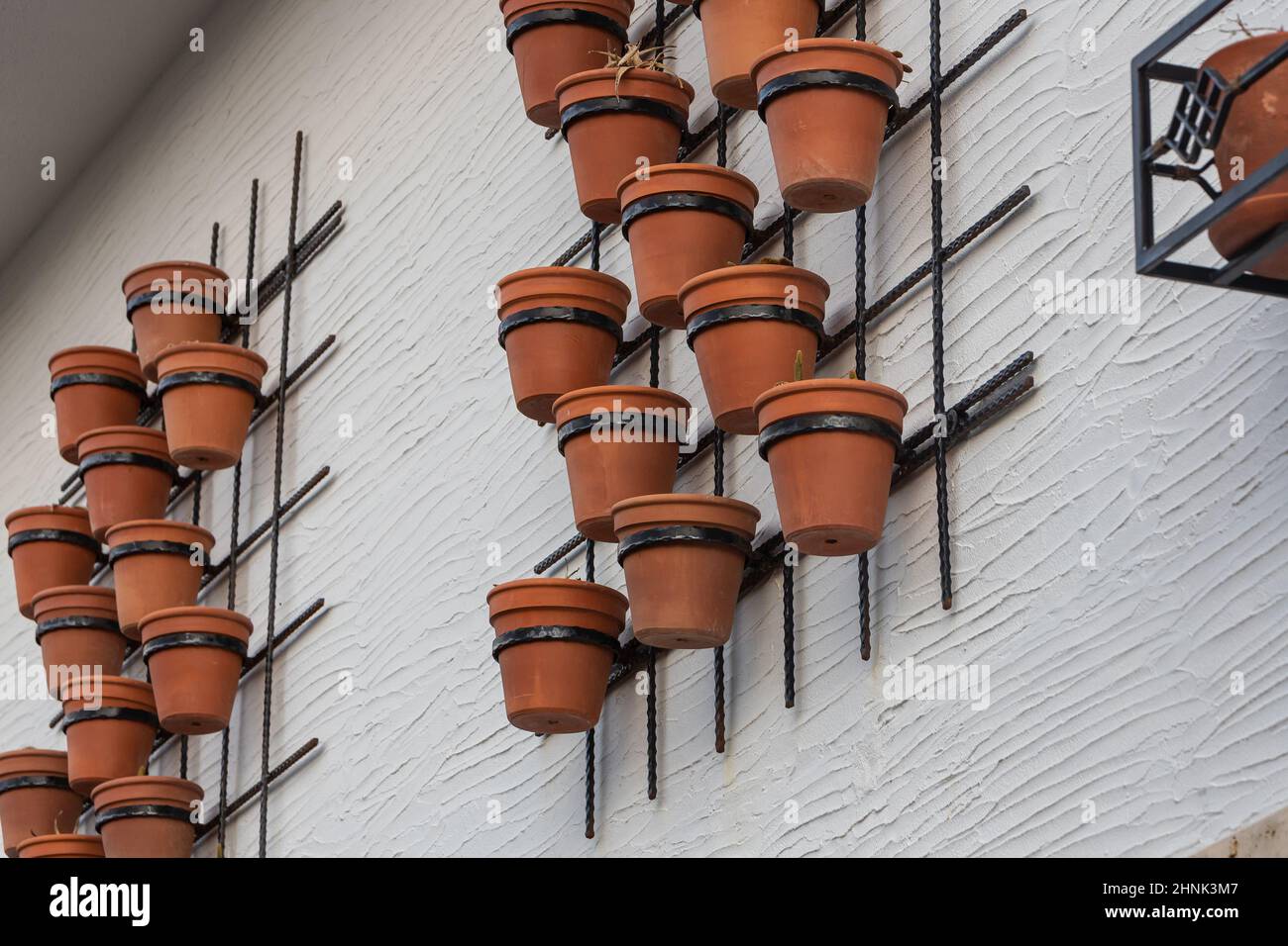 Close-up clay pots on a stone wall Stock Photo