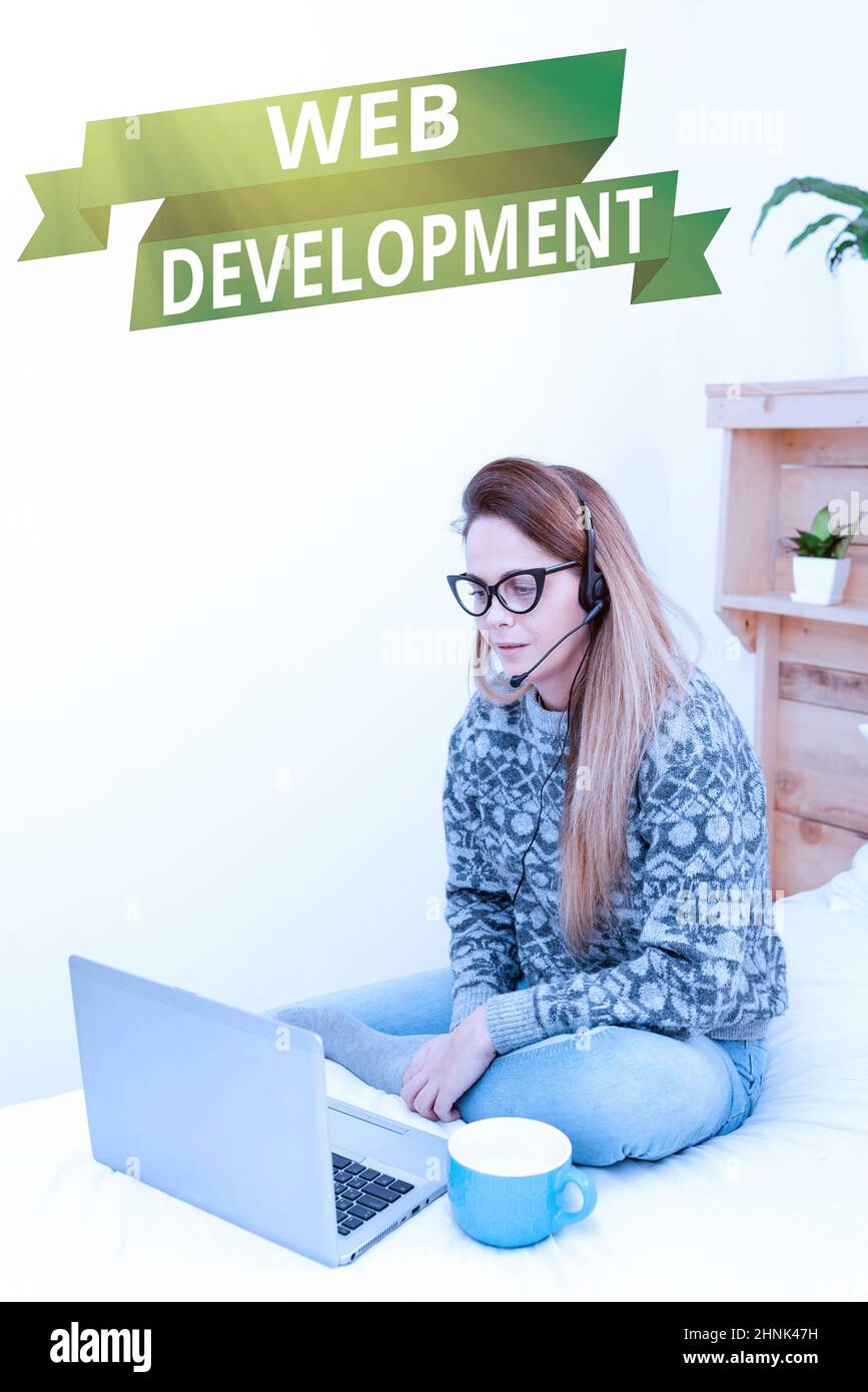 Text caption presenting Web Development, Business concept dealing with developing websites for hosting via intranet Entrepreneur Checking And Reading Stock Photo