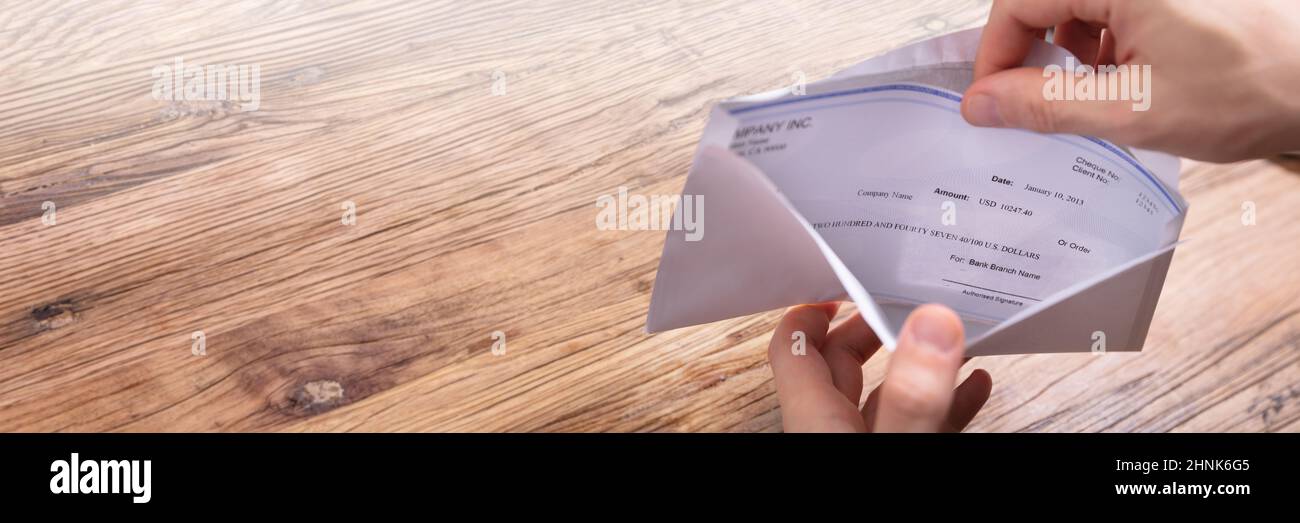 Paycheck In Open Envelope. Holding Payroll Cheque Stock Photo Alamy