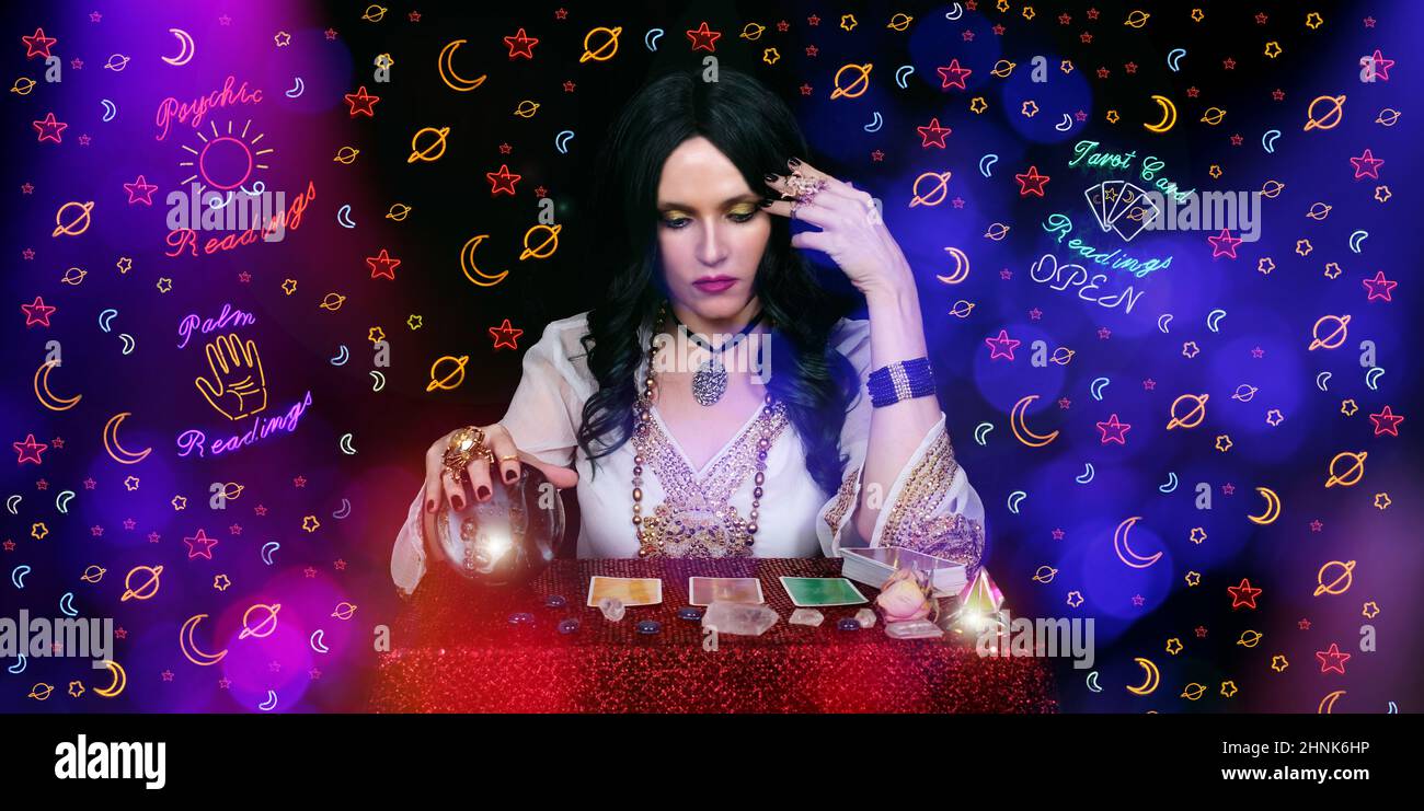 Psychic Tarot Card Reader With Neon Signs Stock Photo