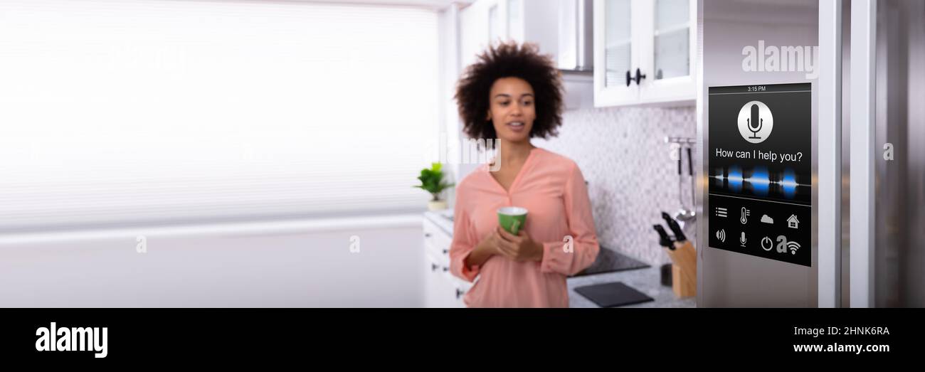 Smart Fridge In Kitchen. Voice Recognition Refrigerator Control Stock