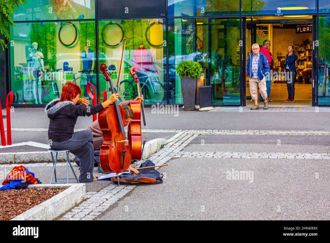 Red-haired street musicians with cello string in Norway Stock Photo