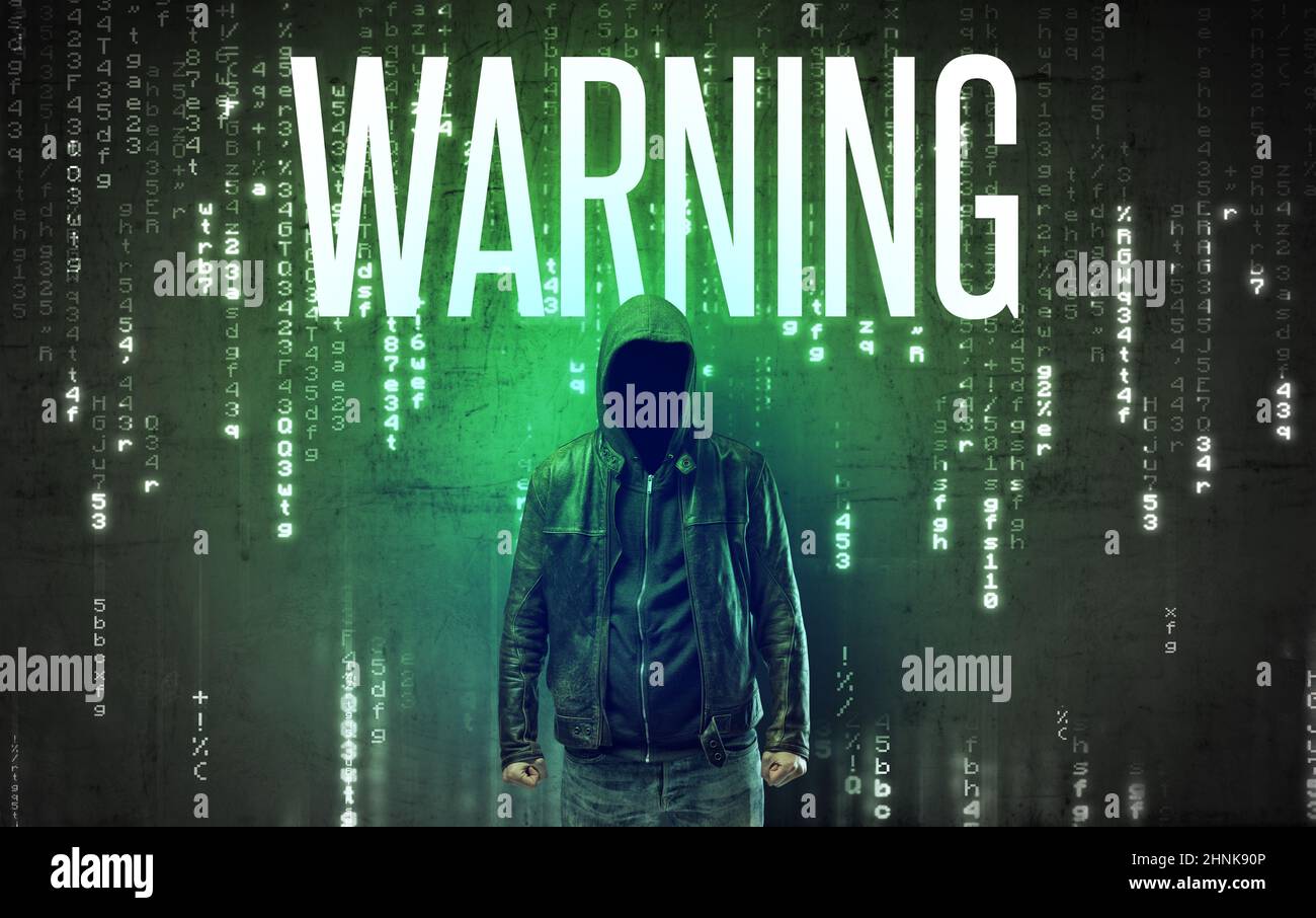 Faceless hacker with inscription Stock Photo