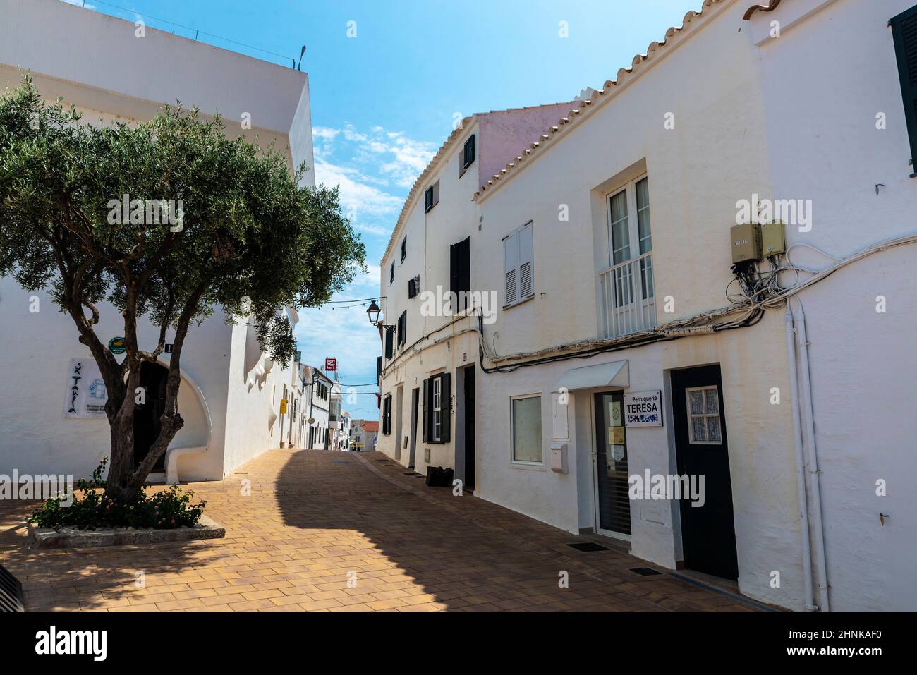 Fornells, Spain - July 21, 2021: Street of the white village of Fornells on summer in Menorca, Balearic island, Spain Stock Photo
