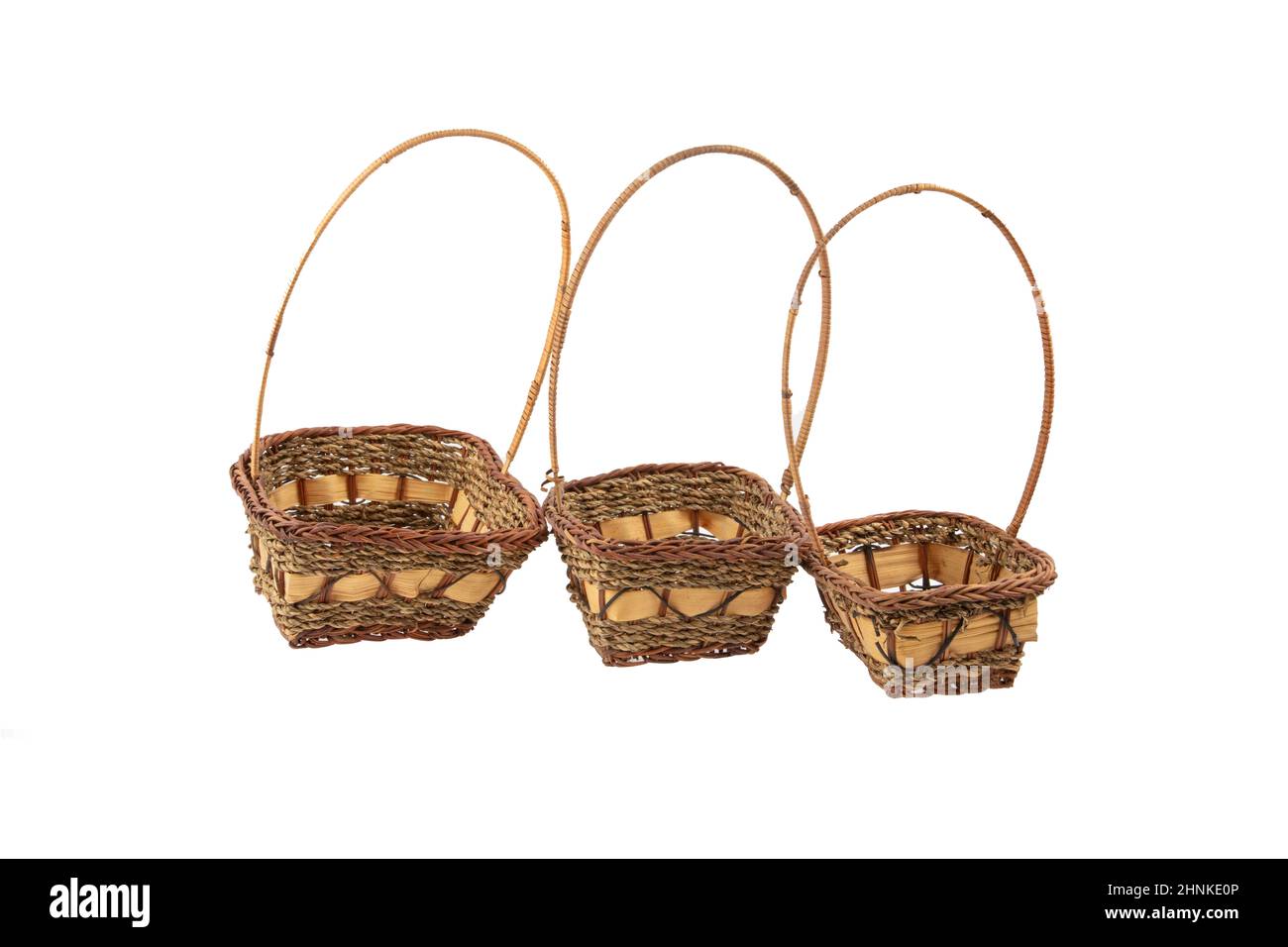 Stack of wicker straw osier handmade baskets different size and pattern