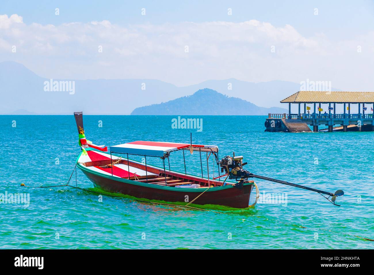 Long-tail boat at pier on island Koh Phayam Thailand. Stock Photo