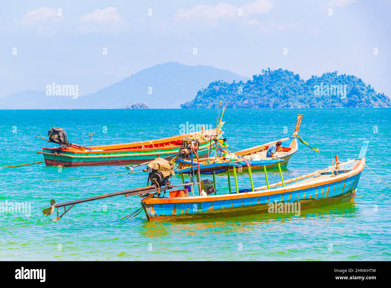 Long-tail boats at pier on island Koh Phayam Thailand. Stock Photo