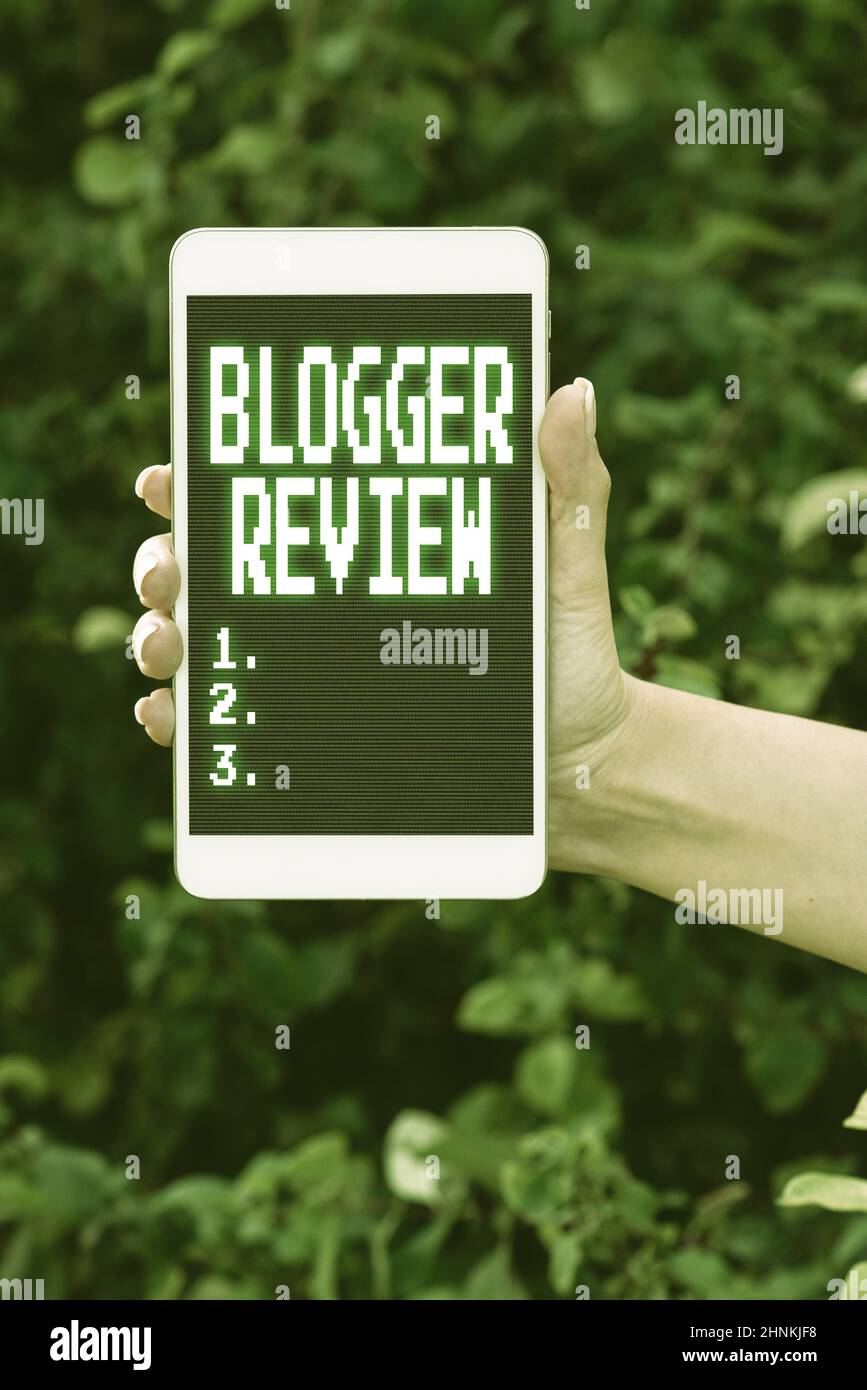Text caption presenting Blogger Review, Concept meaning making a critical reconsideration and summary of a blog Voice And Video Calling Capabilities C Stock Photo