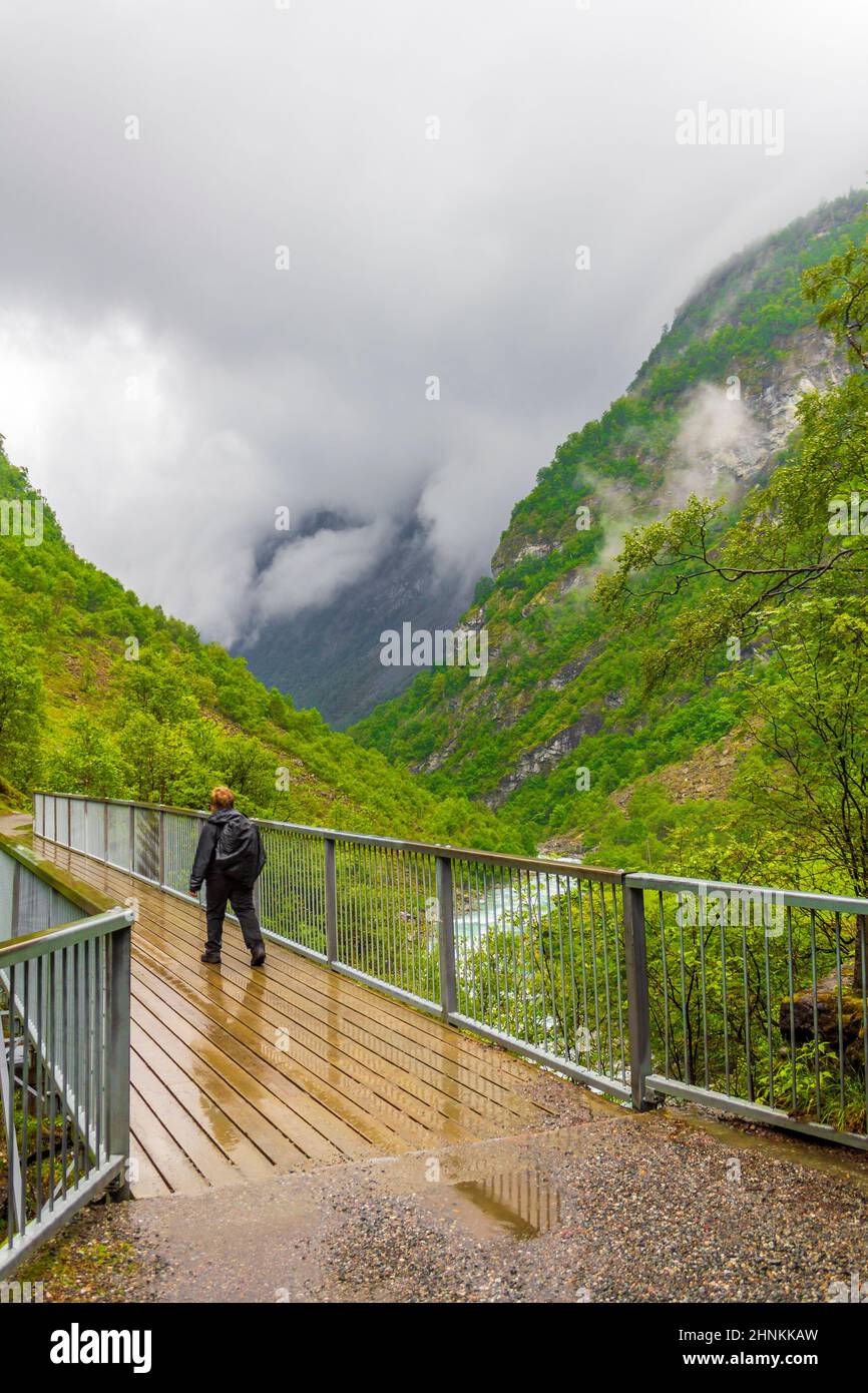 Beautiful wooden bridge above turquoise river Utla Utladalen Norway landscapes. Stock Photo