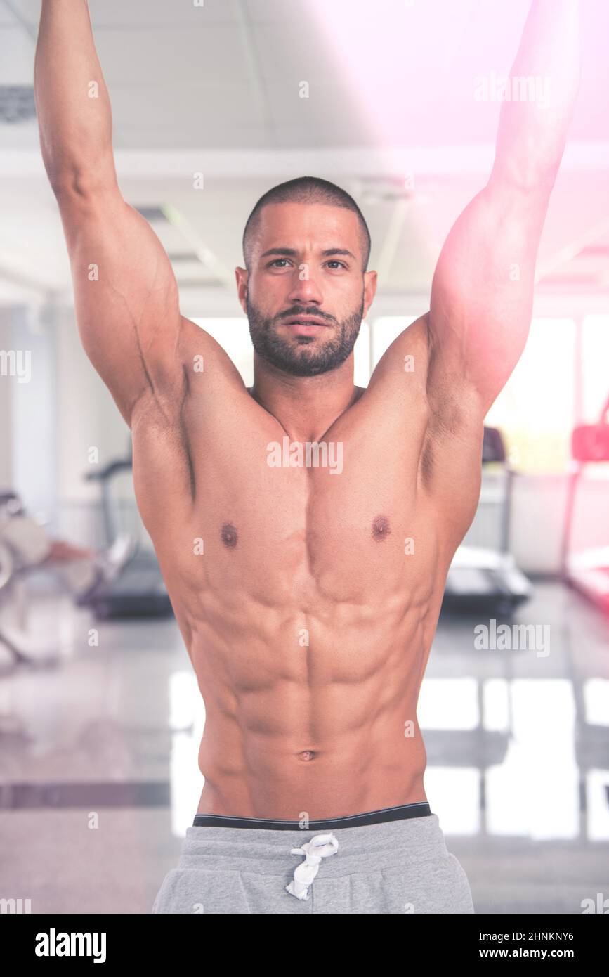 Model Performing Hanging Leg Raises Exercise Ab Exercises Stock Photo