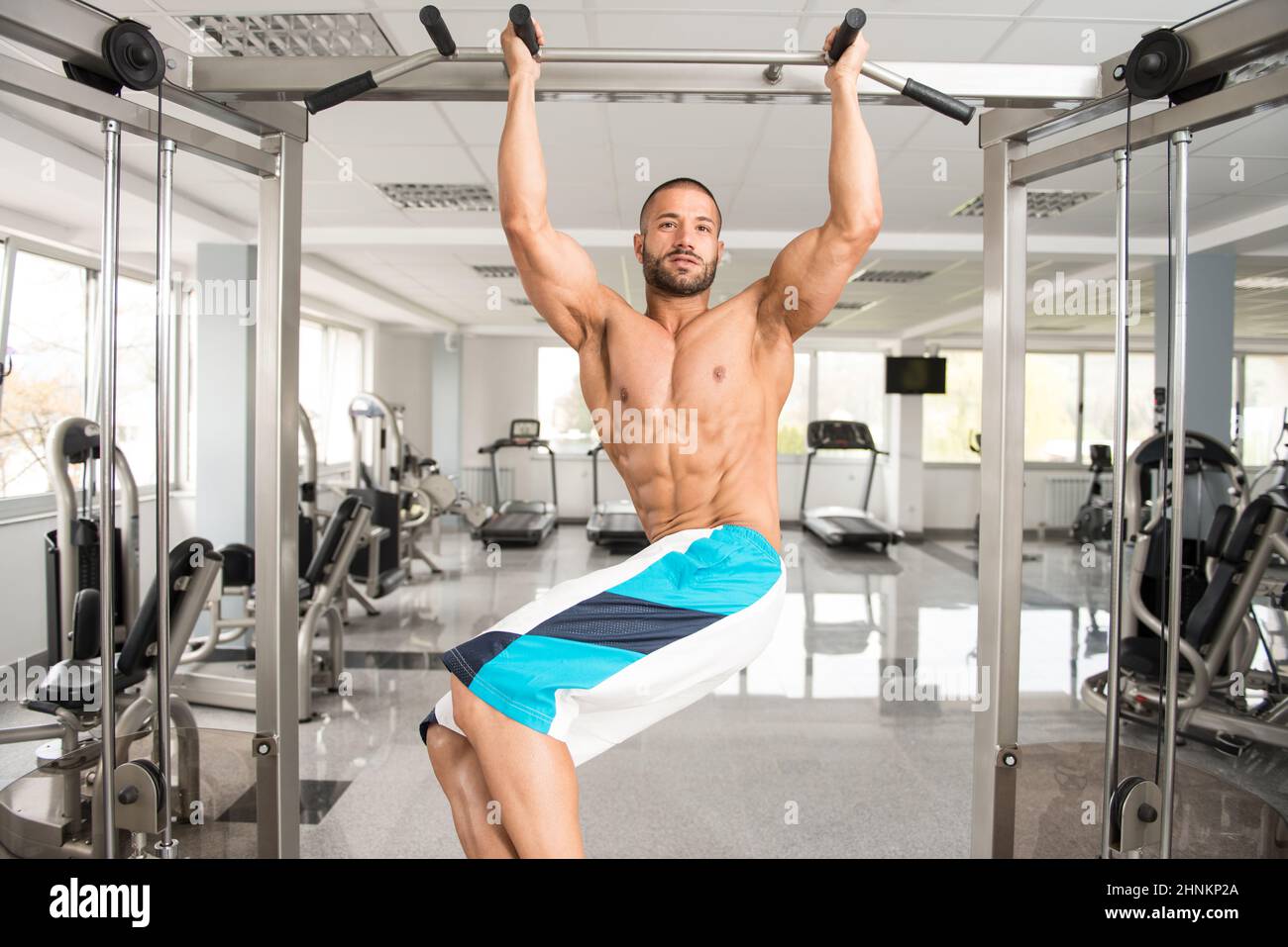 Model Performing Hanging Leg Raises Exercise Ab Exercises Stock Photo