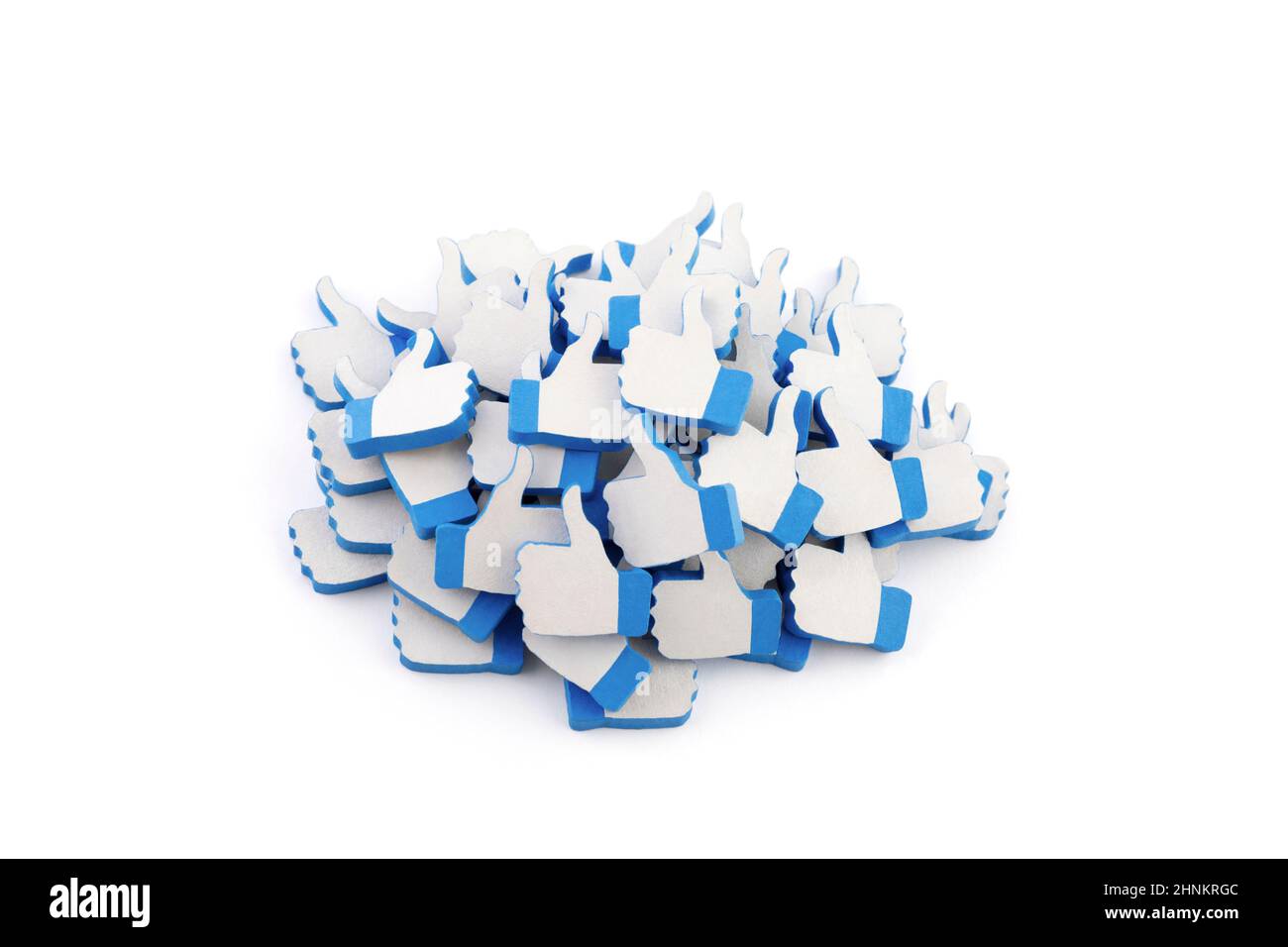 Many blue like thumb up icons on white background with clipping path. Social media concept Stock Photo