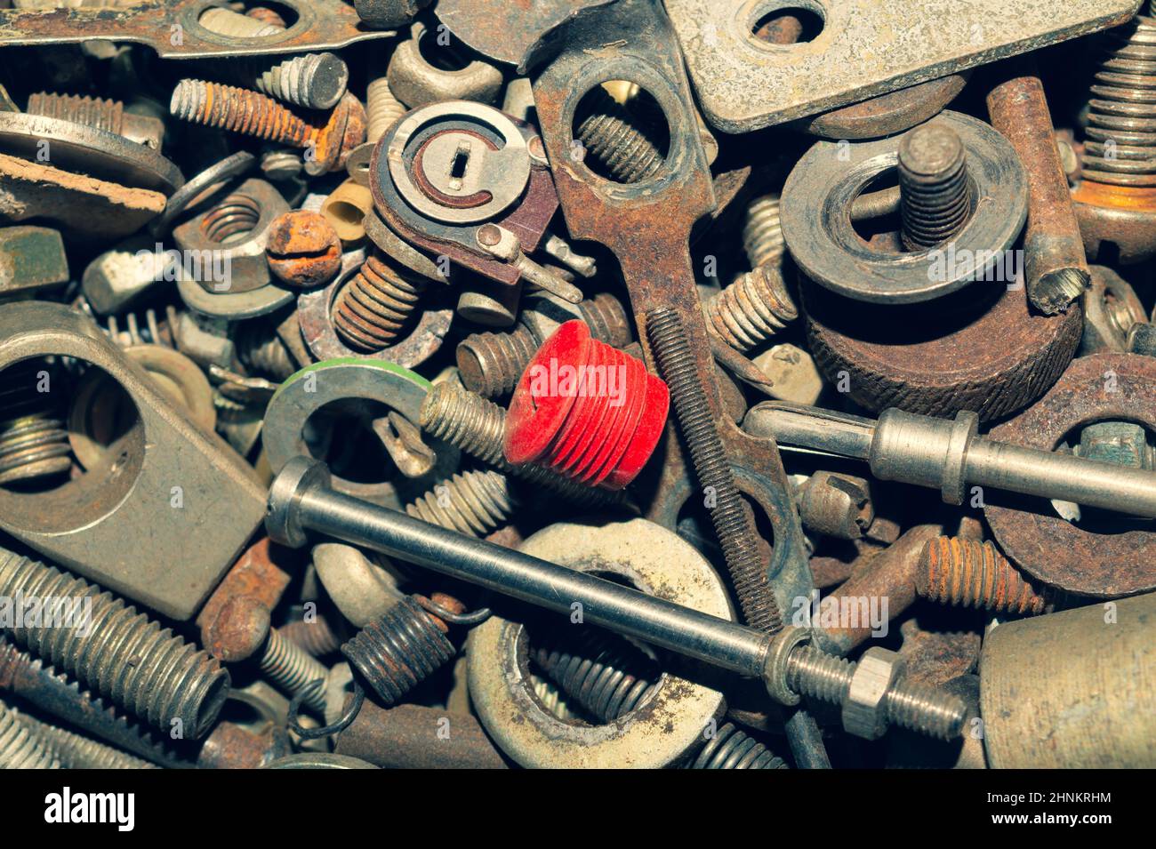 Pile of fasteners and screws close up. scrap metal. different metal