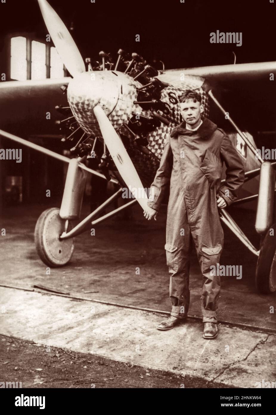 Charles A. Lindbergh (1902-1974) is shown next to his plane, Spirit of St. Louis, shortly after his arrival in New York at Roosevelt Field in Long Island to prepare for his May 20, 1927, historic first solo nonstop trans-Atlantic flight to Paris. Stock Photo