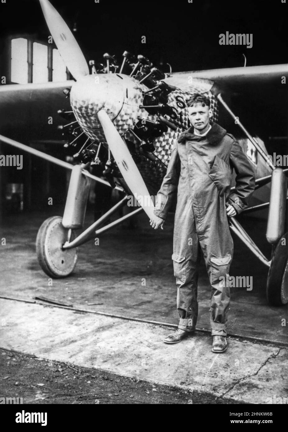 Charles A. Lindbergh (1902-1974) is shown next to his plane, Spirit of St. Louis, shortly after his arrival in New York at Roosevelt Field in Long Island to prepare for his May 20, 1927, historic first solo nonstop trans-Atlantic flight to Paris. Stock Photo