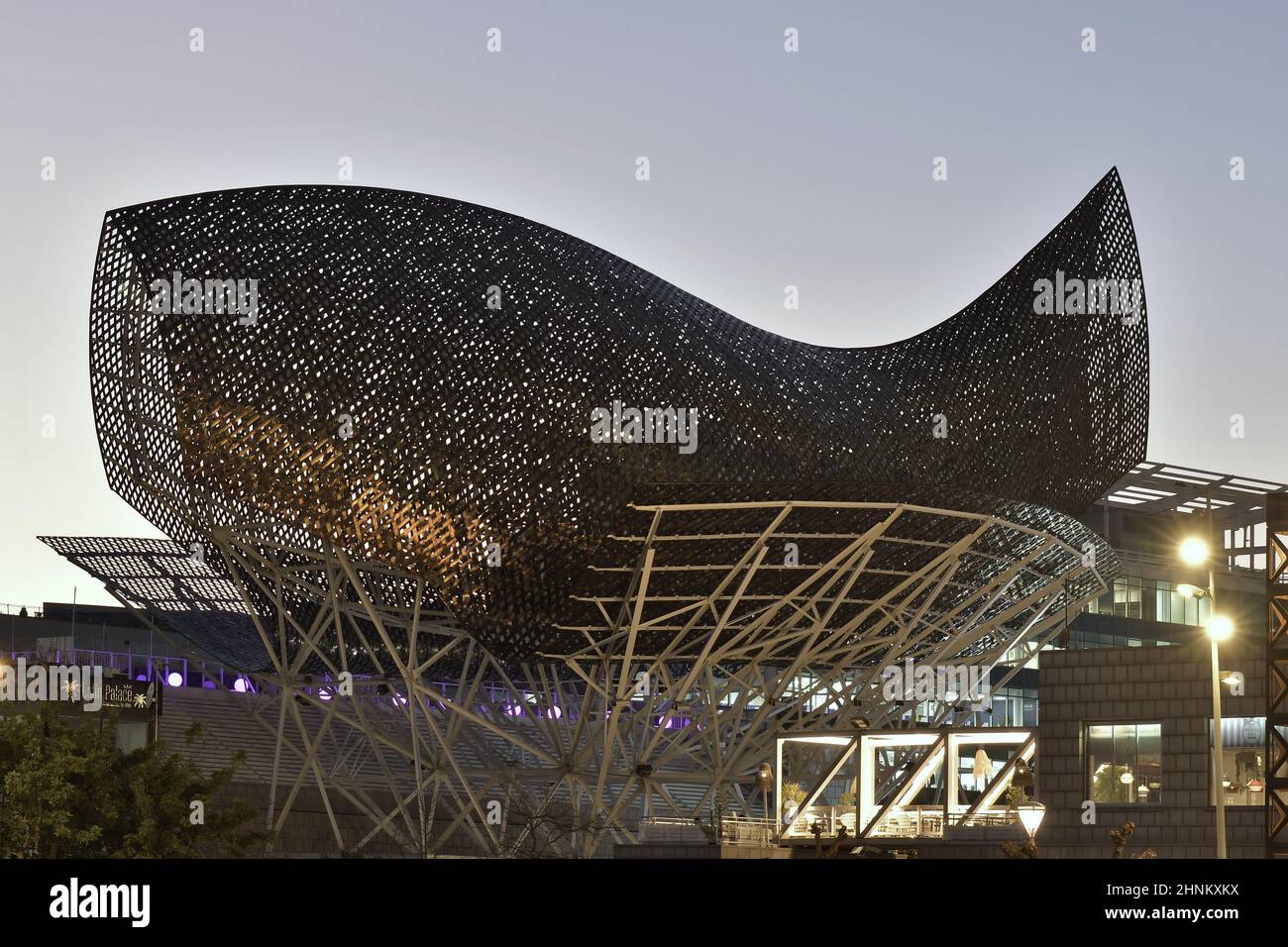 Peix (Golden Fish) modern steel sculpture at dusk, designed by Frank Gehry  architect, located in Port Olimpic of Barcelona Spain Stock Photo - Alamy