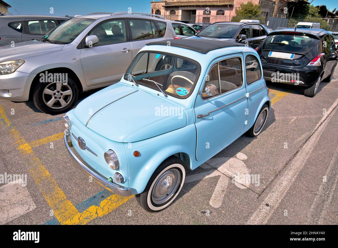Iconic italian car Fiat 500 in turquoise blue color view. Stock Photo