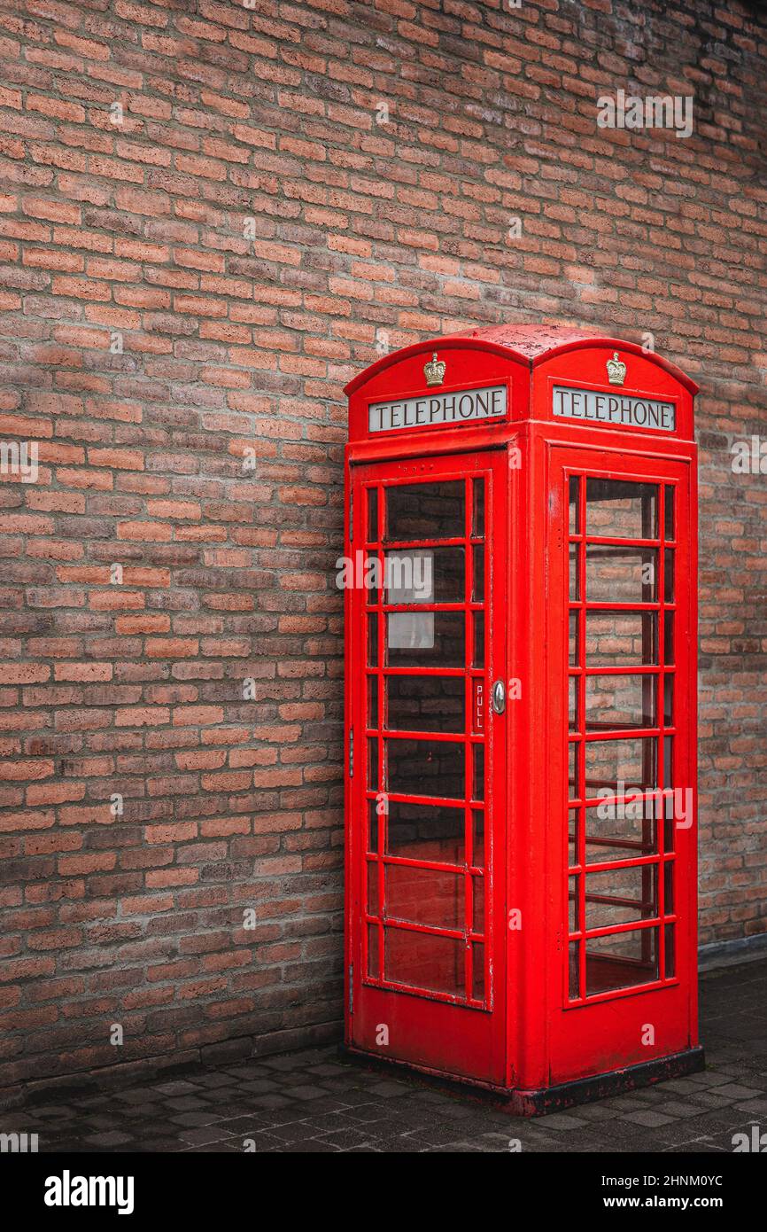 The traditional British public red telephone kiosk or booth Stock Photo