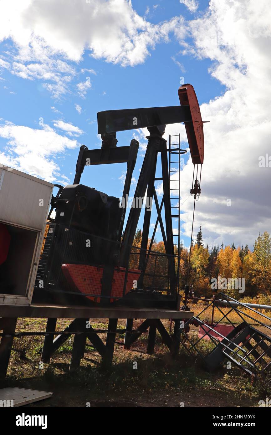 The arm on a jumpjack pumping for oil Stock Photo