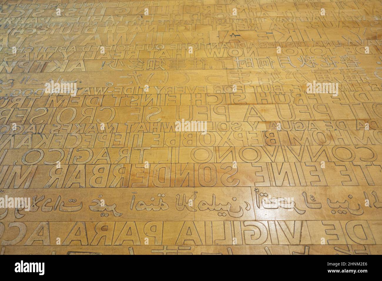The Ann Hamilton raised lettering floor, at the Seattle Public Library, Central Library Location, in Seattle, Washington. Stock Photo