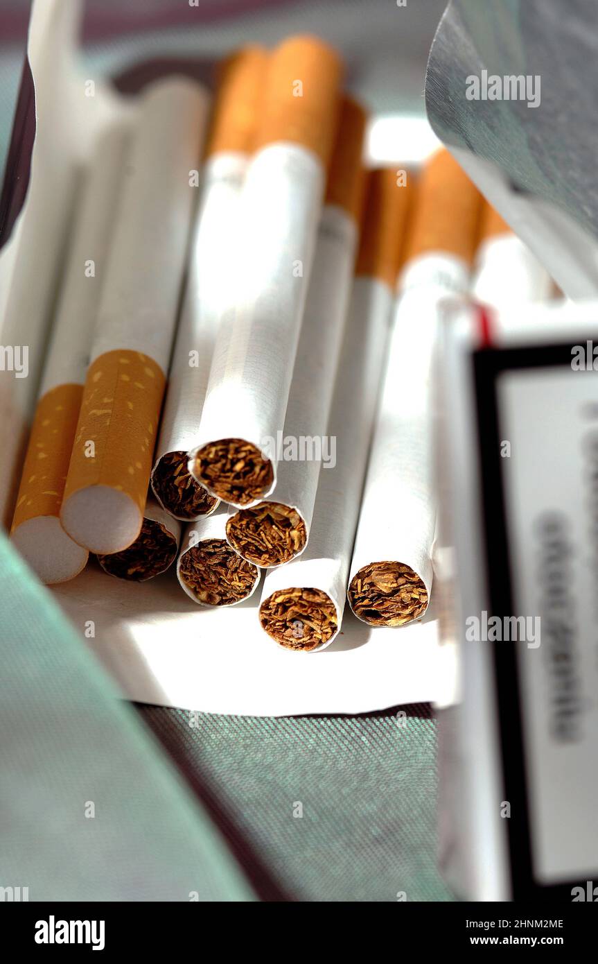 different types of cigarettes on a white background Stock Photo