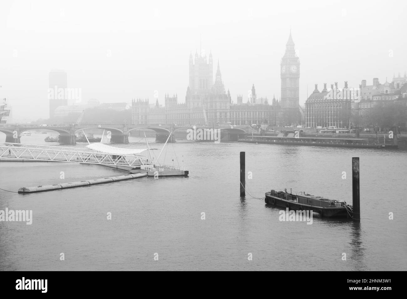 Black and white image of fog descending on the River Thames with Parliament Stock Photo