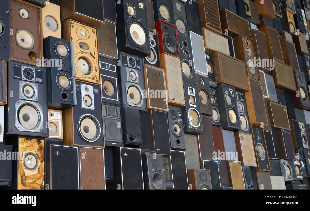 Maastricht, Netherlands - February 13. 2022: View on isolated wall many stacked music vintage loudspeaker boxes Stock Photo
