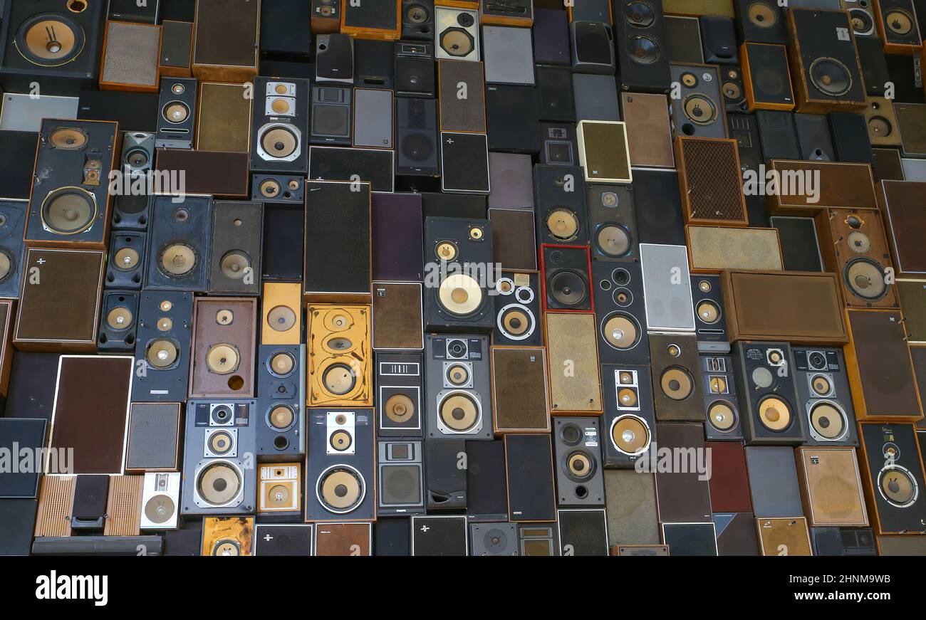 Maastricht, Netherlands - February 13. 2022: View on isolated wall many stacked music vintage loudspeaker boxes Stock Photo