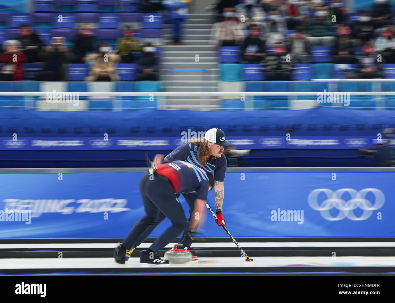 Beijing, China. 17th Feb, 2022. Matt Hamilton (Rear) and John Landsteiner of the United States compete during the curling men's semifinals of the Beijing 2022 Winter Olympics between the United States and Britain at the National Aquatics center in Beijing, China, Feb.17, 2022. Credit: Wang Jingqiang/Xinhua/Alamy Live News Stock Photo