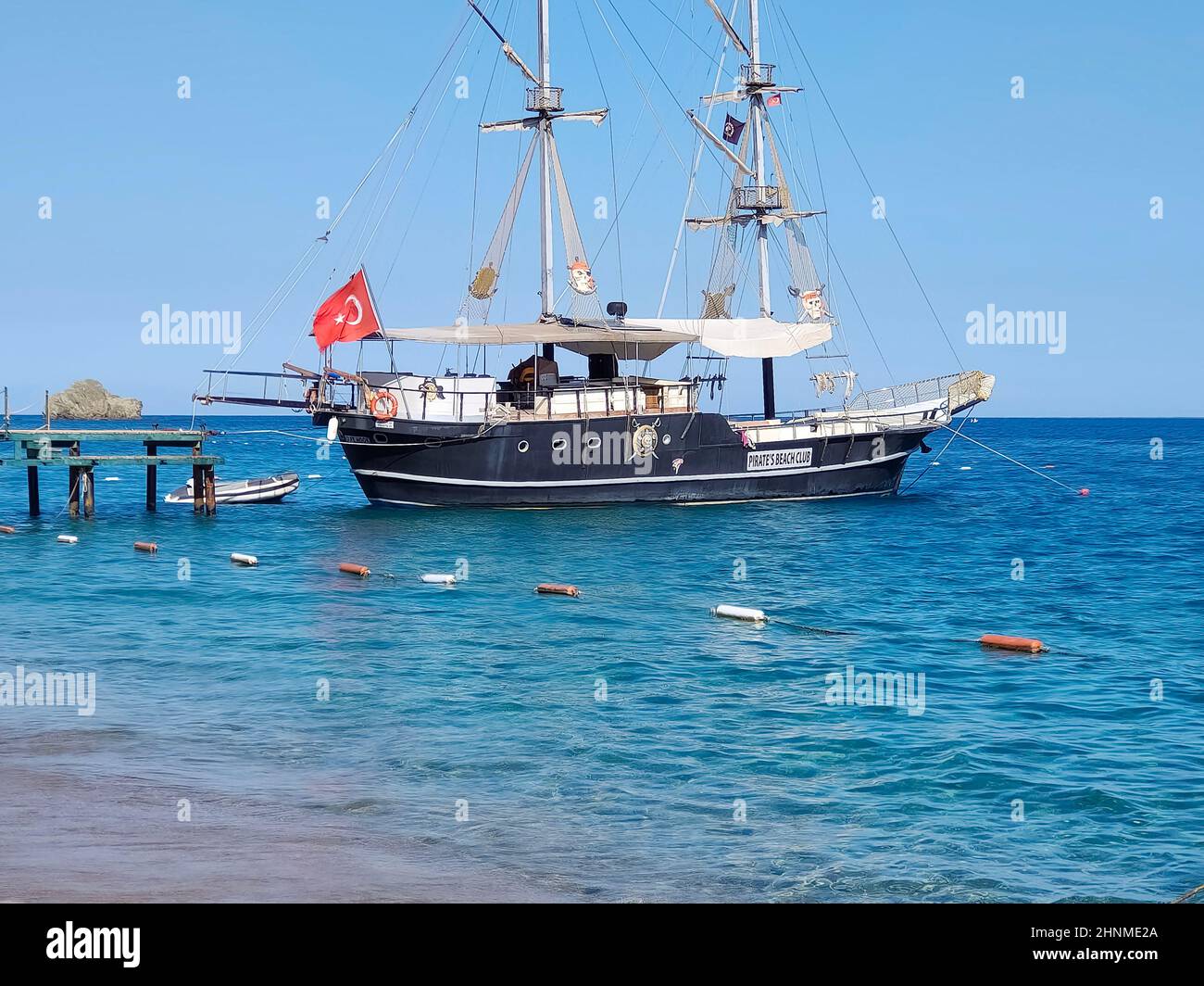 Bay in mediterranean sea with old yacht and fun sun in the Kekova. Turkey. Stock Photo