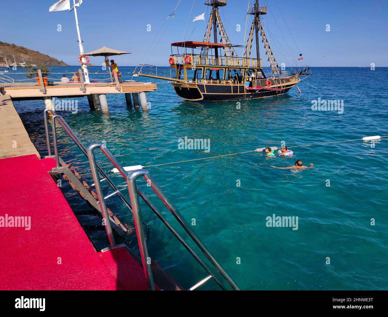 Bay in mediterranean sea with old yacht and fun sun in the Kekova. Turkey. Stock Photo