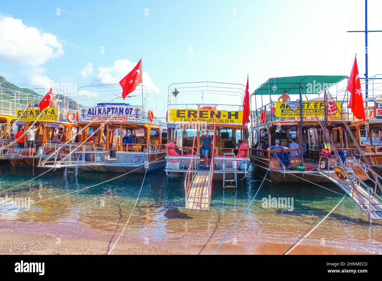 People having fun at yacht on the shore of the cozy bay of Adrasan, near Antalya and Kemer, Turkey Stock Photo