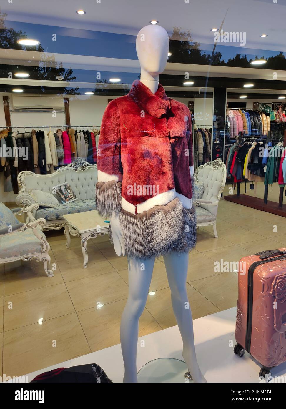 womans many color winter fur clothes in fashion shop , Fashion clothes, interior Stock Photo