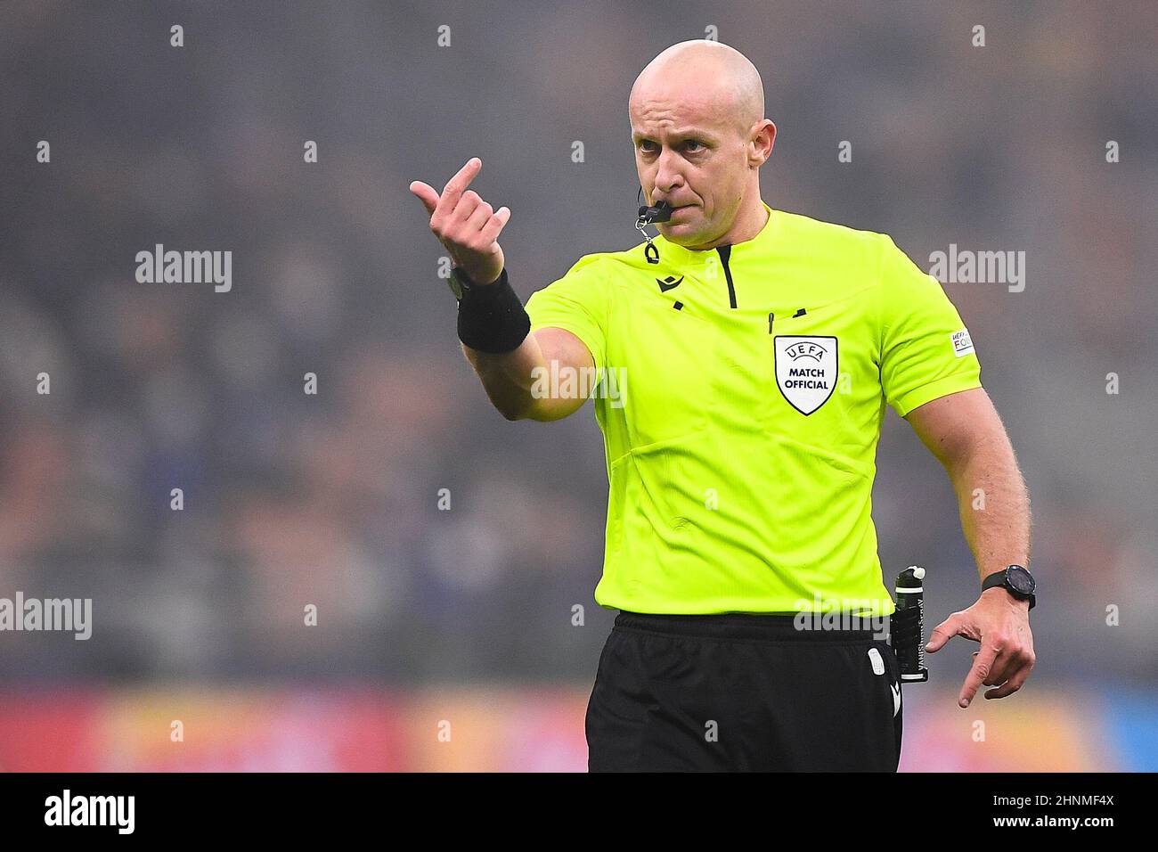 Milan, Italy. 16 February 2022. Referee Szymon Marciniak gestures during the Champions League round of sixteen first leg football match between FC Internazionale and Liverpool FC. Credit: Nicolò Campo/Alamy Live News Stock Photo