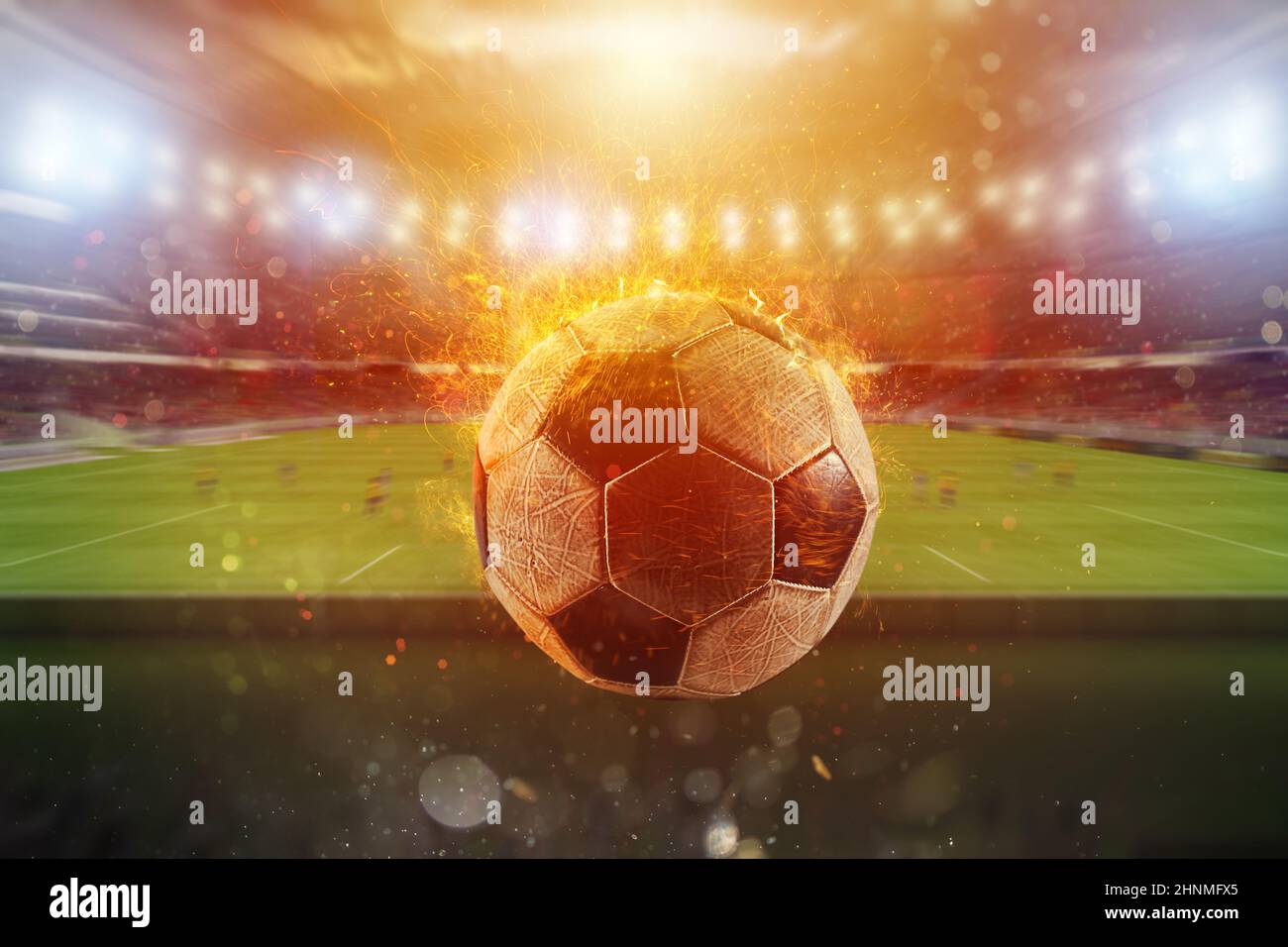 Fiery soccer ball exits from a stadium Stock Photo - Alamy