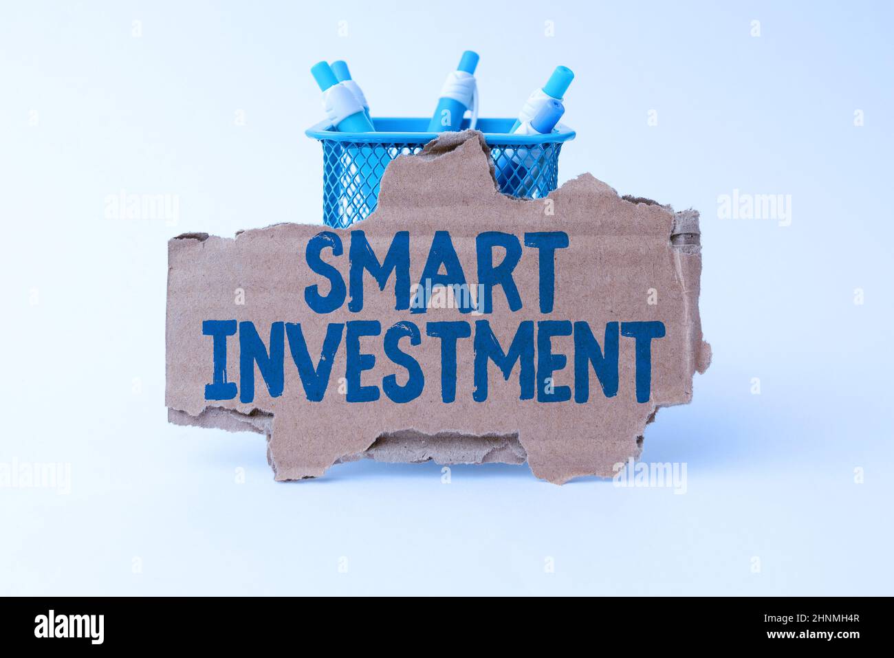 Text sign showing Smart Investment, Word for Allocating funds to an asset or committing capital Tidy Workspace Setup Writing Desk Tools And Equipment Stock Photo